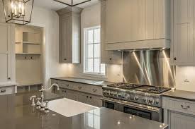 Again, these can be matched with a concrete counter top. Gray Shiplap Kitchen Hood With Stainless Steel Cooktop Backsplash Cottage Kitchen