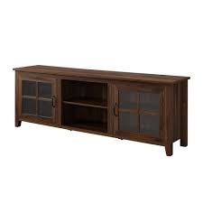 Whether you need a piece of furniture to hold the television or your impressive movie collection, wood media consoles are ideal living room or game room furniture.open shelves display decorative elements as well as books, while doors and drawers contain cords, game systems and anything else you'd prefer to keep out of sight. Glass Door Console Tv Stand For Tvs Up To 80 Dark Walnut Saracina Home Target