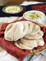 Pita Bread Made Using Roughly Half Whole Wheat Flour And Half White Flour The Pitas Are On A Basket With A Red Pita Bread Recipe Fool Proof Recipes Recipes