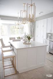 Sure, the decorations help, but it's really that crisp, clean white paint that makes the room feel brighter, bigger, and just more welcoming. Our Dark To White Kitchen Remodel Before And After Setting For Four