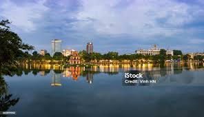 Hoan Kiem Lake Panorama View At Sunset Period With Ancient Turtle Tower And  Hanoi Post Office Is Center Of Hanoi Stock Photo
