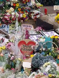 A photograph of sarah everard sits among the floral tributes and candles placed in clapham common in london on march 15. Sarah Everard The Masked Months Mylondonpassion