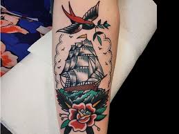 Courage commitment navy tattoo on upper back. 9 Stunning Ship Tattoo Ideas Designs And Meaning Styles At Life