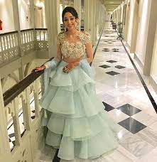 Setting Our Hearts Aflutter Roshini Kapoor Is The Epitome Of Romance In An Ice Blue Ruffle Lehenga A Indian Gowns Dresses Indian Wedding Gowns Bridal Outfits