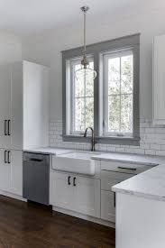 Love The White Cabinets Farmhouse Sink And Gray Painted Window Trim In This Kitchen Barrow Modern Farmhouse Kitchens New Kitchen Cabinets Kitchen Renovation
