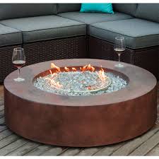 Relax by the warmth of an inviting fire on a cool summer night this steel propane fire pit table, nice looking wicker design on the base, colour matches the bronze colour family furniture, used as a fire pit. Cosiest Outdoor Propane Fire Pit Tank Outside On Sale Overstock 31500538