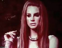 Lana Del Rey tells sombre tale of drug-addicted street walking teenager in  video for Carmen