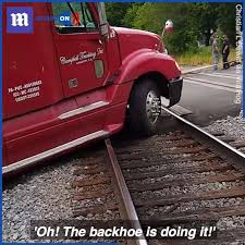 In the video, the terrified animal writhes around with its head sticking out of the sun roof. Daily Mail Truck Gets Stuck On Railroad Tracks Facebook