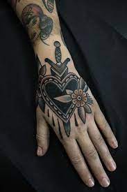 25 Awesome Hand Tattoo Designs Traditional Hand Tattoo Traditional Tattoo Flowers Badass Sleeve Tattoos