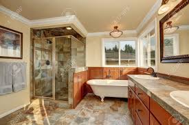 Look through corner double vanity. Bathroom With Natural Stone Tile And Beige Walls Glass Corner Shower Freestanding White Tub And Double Sink Vanity Bathroom Northwest Usa Stock Photo Picture And Royalty Free Image Image 62170729