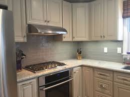 Grey Glass Subway Tile Kitchen Backsplash With White Cabinets Glass Tile Backsplash Kitchen Glass Tiles Kitchen Kitchen Backsplash Designs