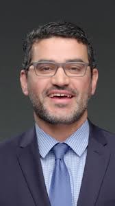 Amr Mohsen, MD (left), and Jason Hoff, MD (right), reunited with patient  Donald Oaks and his wife (center) outside of Loma Linda University Medical  Center. The cardiologists partnered with Oaks to perform