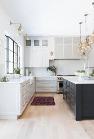 A hardwood floor for the kitchen can never be wrong. Light Wood Floors With Light Gray Kitchen Cabinets Transitional Kitchen