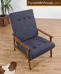 This gorgeous pair of contemporary modern lounge chairs feature unique metal rod bases with hairpin style feet. Restored Mid Century Modern High Back Lounge Chair