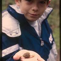 Joshua Roach, 11 years old, points to the sky where