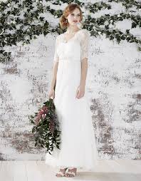 Crafted From Delicate Ivory Lace Our Nevena Bridal Dress Is Adorned With A V Shaped N Wedding Dresses Uk High Street Wedding Dresses Wedding Dresses Under 500