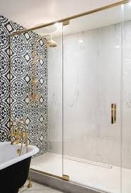 Bifold shower enclosures and doors. Glass And Brass Shower Enclosure Filled With Marble Slabs Contemporary Bathroom