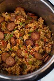 Stir in the rice, then reduce the heat to low and cover the dutch oven. Instant Pot Chicken And Sausage Jambalaya Tastes Better From Scratch