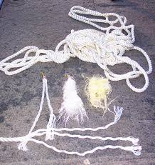 Mark Beason can make a year's supply of gar lures out of a few feet of 3/8s  inch nylon rope. He unravels the rope and separates the three strands,  cutting each into