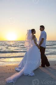 Best spot for privacy for your sunset beach wedding is at the southern point of treasure island. Bride Groom Married Couple Sunset Beach Wedding 1256017 Stock Photo At Vecteezy
