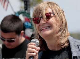 Demonstrators pledge support for immigrant neighbors in New Bedford  workers' march.