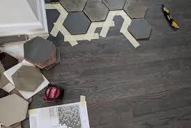 This home's transition from tile to wood flooring adds a touch of whimsy while not being feeling unorganized. How To Floor Transition From Tile To Wood Mercury Mosaics