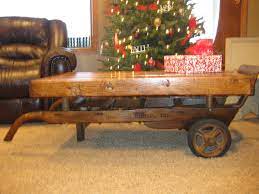 From the time i bought it, i had planned on turning it into a coffee table, but one thing led to another and it just now got completed. My Parents Old 2 Wheel Feed Cart Turned Into A Coffee Table Using Old Pallet Boards Yes We Made It Cart Coffee Table Diy Coffee Table Antique Coffee Tables