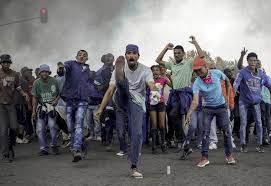 In johannesburg, hundreds defied restrictions in two disenfranchised suburbs, but their protests ended in violence, looting and 25 arrests, police said. Rioters And Police Clash In Johannesburg Protest