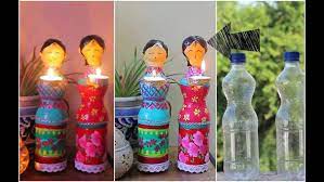 How To Make Doll Diya Using Plastic Bottles These Cute Diya Dolls Made From Waste Plastic Bottles Will Add Diy Diwali Decorations Diwali Diy Diwali Decorations