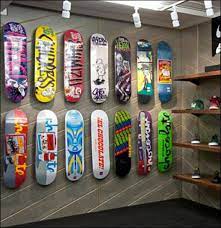 The asymmetrical etagere/bookcase design has multiple levels of large and small shelves perfect in form and function. Skateboards On Angled Slatwall Fixtures Close Up Skateboard Skateboards Skateboard Photography