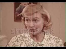 Mother teaches daughter how to use a sanitary belt