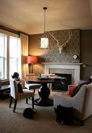 You may want to consider using a loveseat in place of a full couch. Cozy Up To A Loveseat At The Table