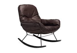 Solid wood gliding chair set with pockets and ottoman for relaxing. Leyasol Rocking Lounge Chair By Freifrau Stylepark