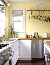 Bright white spaces make rooms seem larger, especially in small kitchens, bathrooms, or laundry rooms. 25 Yellow And White Kitchens That Raise The Mood Digsdigs