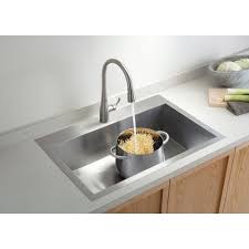 Stainless steel sinks are ideally suited to a variety of different settings and look equally as good in contemporary and traditional kitchen styles. Kohler Vault Dual Mount Stainless Steel 33 In 1 Hole Single Bowl Kitchen Sink With Basin Rack K 3821 1 Na The Home Depot Single Bowl Kitchen Sink Single Sink Kitchen Steel Kitchen Sink