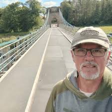 I was so shocked by this bridge at Lesbury in Northumberland UK that I had  to stop the car and take a picture. It's quite a small road but the  banana-shaped supports