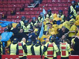 Den mand, der lørdag blev sigtet og varetægtsfængslet i en voldtægtssag, har været ansat som træner i en større dansk fodboldklub i hovedstadsområdet. A Soccer Team In Denmark Is Using Facial Recognition To Stop Unruly Fans Npr