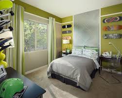 This boys bed features a bunk bed finished in navy blue paint, pairing up with the side table and shelving. Cool And Cozy Boys Room Paint Ideas