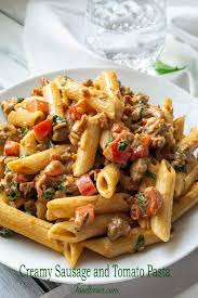 Creamy Italian Sausage And Tomato Pasta Foodtasia Recipe Italian Sausage Recipes Italian Recipes Stuffed Peppers