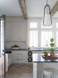 The white kitchen cabinets we have for sale can make any kitchen feel more spacious than it is, bouncing light naturally and freshening up the space. Off White Kitchen Cabinets With Light Gray Wash Herringbone Wood Floor Transitional Kitchen