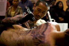 A 'backpiece' is a tattoo which largely or completely covers the back, and can be part of a 'full body suit'. Body Suit Tattoo Wikiwand