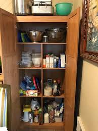 Systembuild kitchen storage pantry cabinet office wood organizer shelf mesh door golden oak. Sauder Storage Cabinet Highland Oak Finish Walmart Com Walmart Com