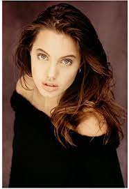 Née voight, formerly jolie pitt, born june 4, 1975) is an american actress, filmmaker, and humanitarian. Young Angelina Jolie Wearing Black Off Shoulder Top Hair Down Looking Up Closeup 8 X 10 Inch Photo At Amazon S Entertainment Collectibles Store