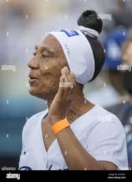 Diana Collins, the mother of Mookie Betts (not pictured) holds  granddaughter Kynlee Betts during the Los Angeles Dodgers Foundation  Thanksgiving Grab Stock Photo