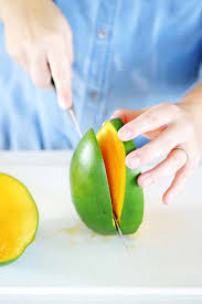 In this video, you'll learn how to cut and peel a mango—you'll see two great techniques for removing the peel and seed, and discover the best way to cut them into cubes without removing the skin. How To Cut A Mango Two Easy Ways Bowl Of Delicious