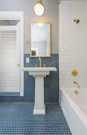 Simple Brass Light Pendant Hangs Over A Kohler Tresham Pedestal Sink In A Bathroom With Blue Mini Mosaic Tiles That Co Best Bathroom Faucets Pedestal Sink Sink
