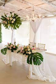 Tropical Theme Wedding Reception Decor With Monstera Leaves Pineapple Centrepieces Gree Hawaiian Wedding Themes Tropical Wedding Decor Tropical Wedding Theme
