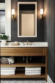 A White Beveled Mirror Contrasts A Bathroom Wall Covered In Black Grasscloth Wallp Grasscloth Wallpaper Small Bathroom Wallpaper Wallpaper Accent Wall Bathroom