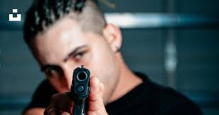 Man aiming gun photo photo