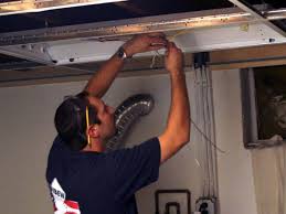 Lay down a drop cloth and set up a ladder so you can access the recessed lighting fixture. Installing A Drop Ceiling In A Basement Laundry Hgtv